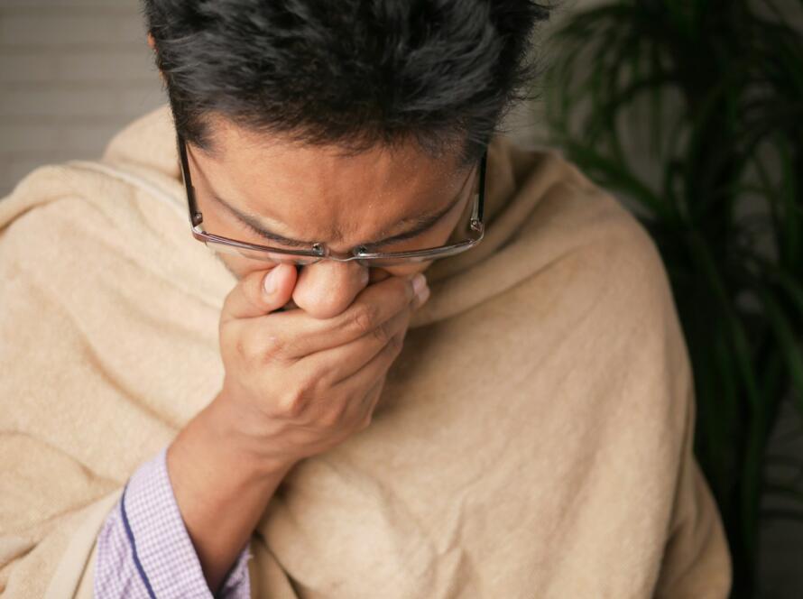 man in brown sweater wearing black framed eyeglasses